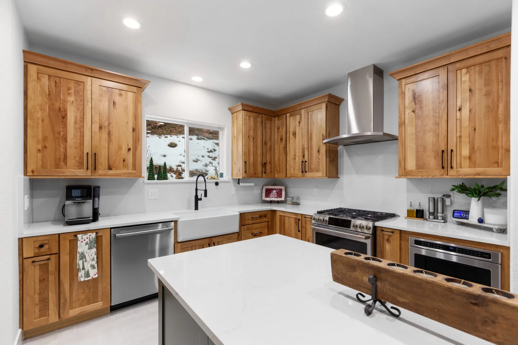 Kitchen renovation with custom wood cabinets and quartz counters