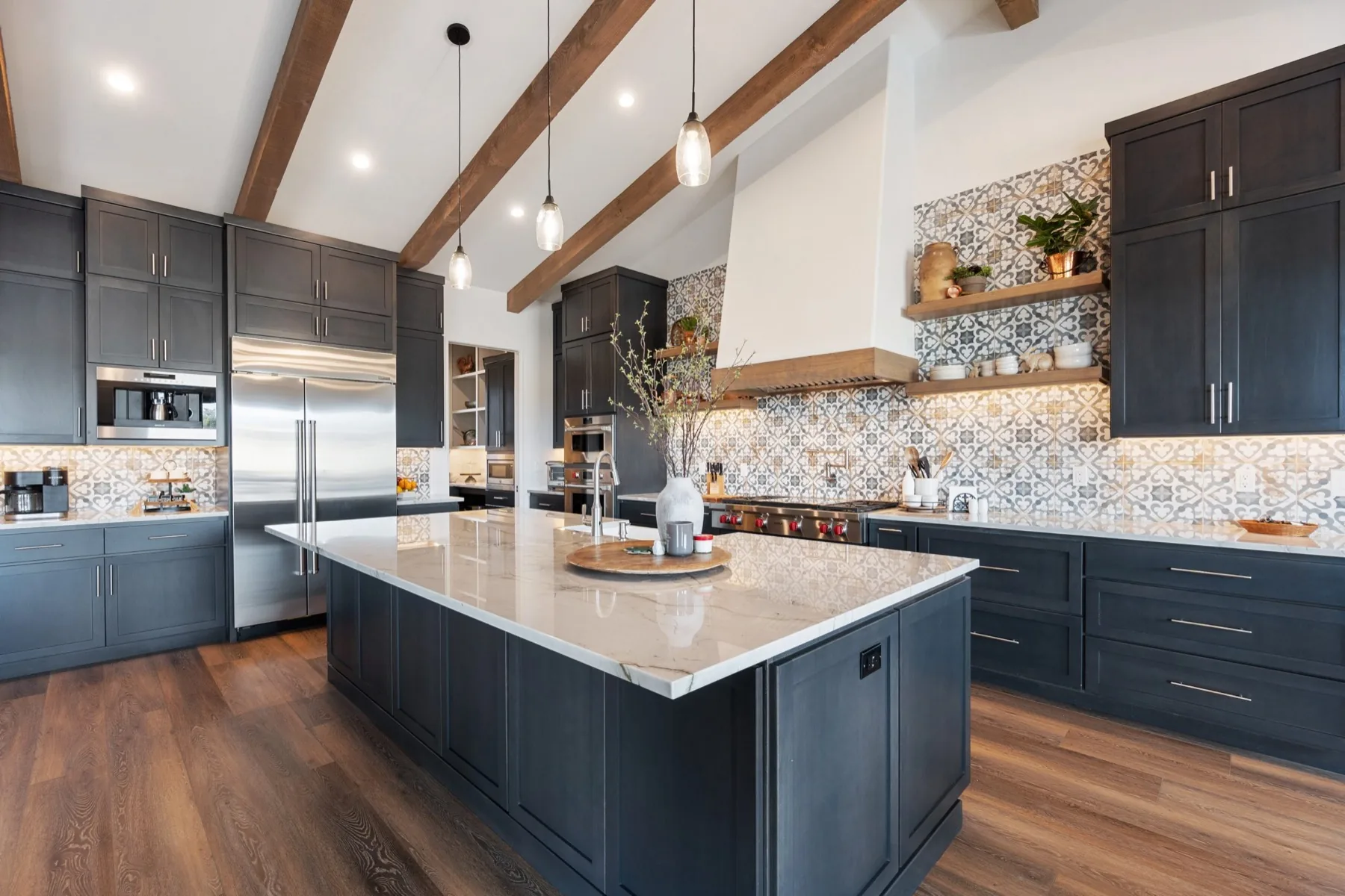 Custom kitchen remodel with navy cabinetry and exposed timber beams by Wahr Home Solutions
